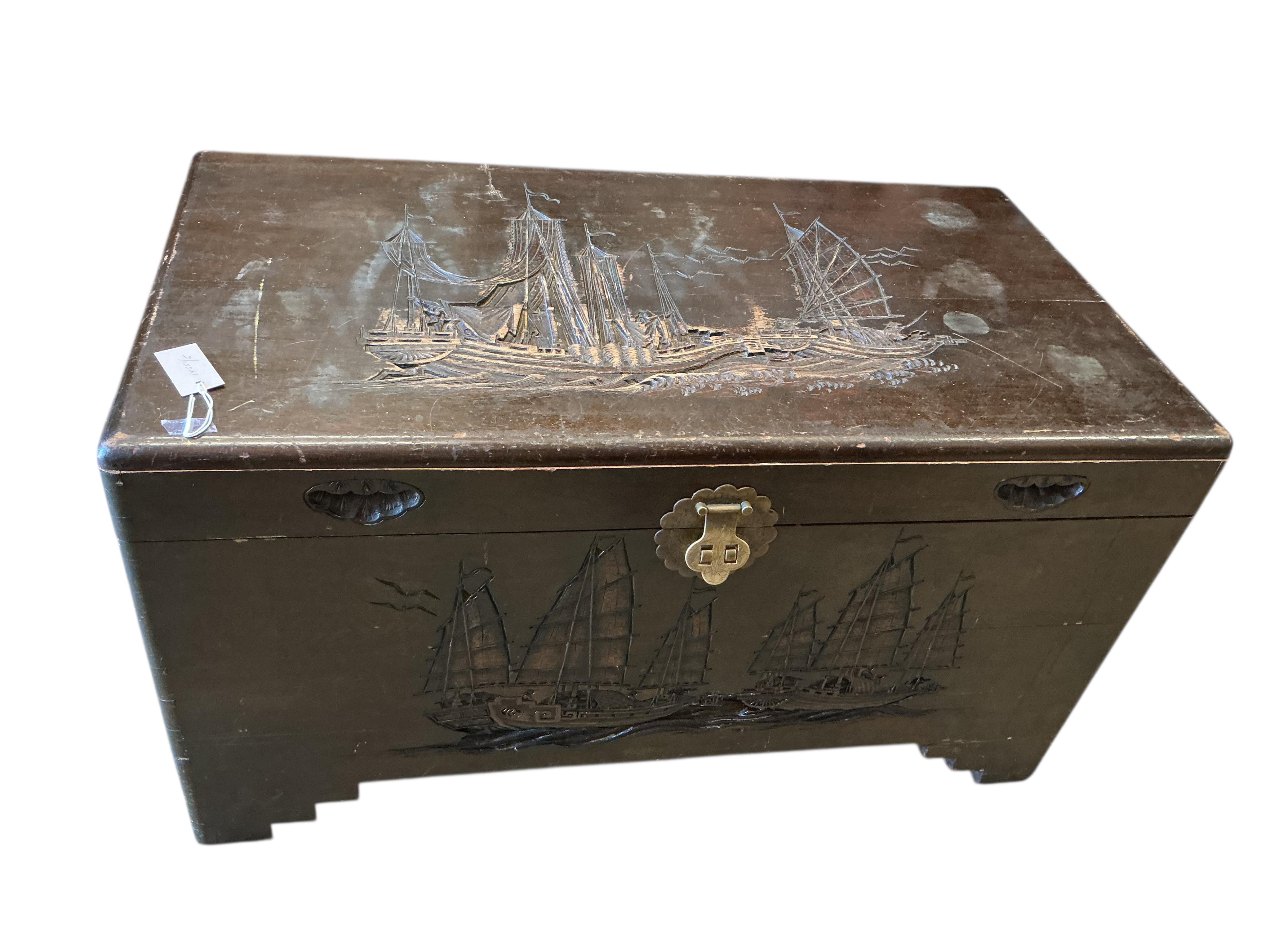 A Chinese carved camphorwood trunk, width 100cm, depth 54cm, height 56cm.